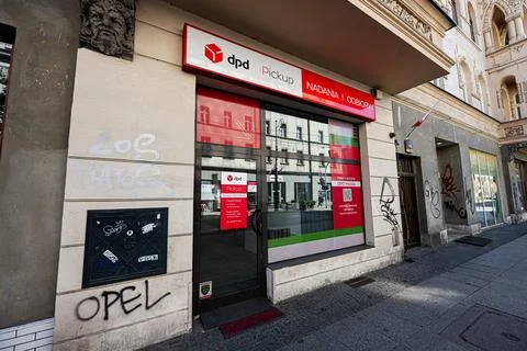DPD pickup parcel shop storefront in Katowice Poland with urban graffiti an.. Stock Photos