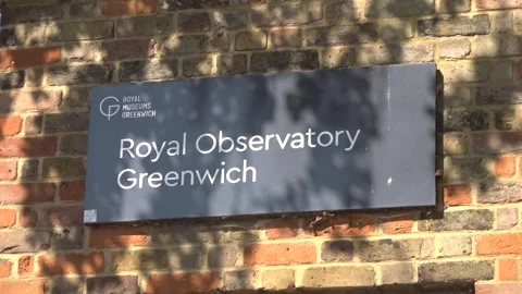 Dr Carys Herber demonstrates the use of solar eclipse glasses at the Royal Obse Stock Footage 341669716
