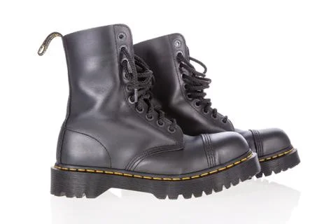 Dr. Martens black leather work boots with steel toe and military style isolated  Stock Photos