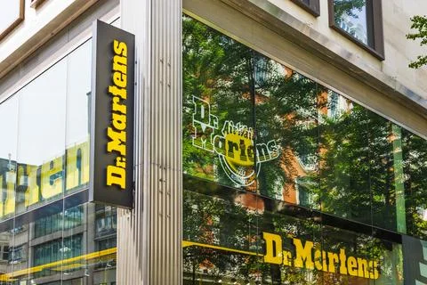 Dr. Martens flagship store with bold yellow signage. London, UK, 11 May 2024 Stock Photos