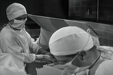Dr. O'Donnell and team successfully completes delivery through surgery - 1940 Stock Footage 98566043