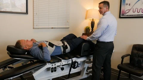 Dr talking to patient in traction Video stock 107764513