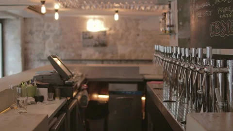 Draft Beer Taps and Empty Bar Counter Interior Handheld Shot 库存影片 347375182