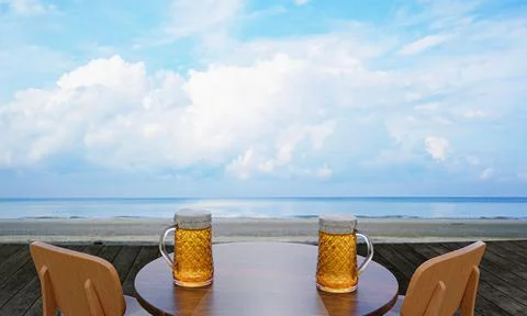 Draft or craft beer in a tall clear glass With beer foam on top And there are Illustrazione stock