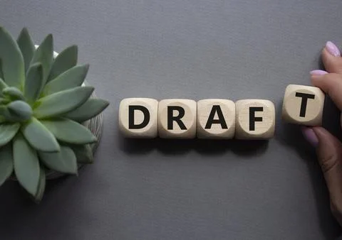 Draft symbol. Concept word Draft on wooden cubes. Businessman hand. Beautif.. Foto stock