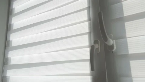 Draft wind shakes fabric blinds curtains. Stock Footage 183264045