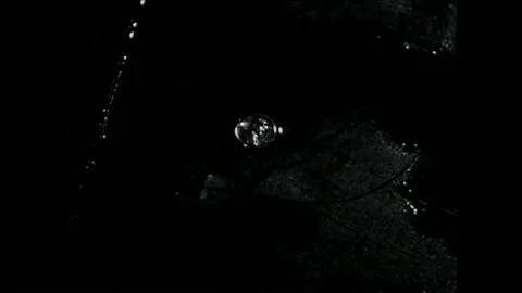 A draftee walks through the rain, finds a penny, and reports to a United States Vídeos de archivo 95066286