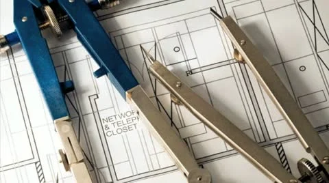 Drafting compass and dividers against a blueprint Vidéo 21307297