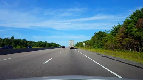 Drafting Large Truck on Highway During Summer Day Stock Footage 113963721