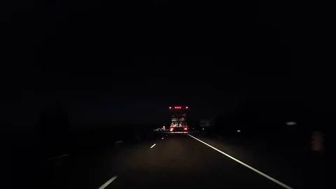 Drafting Large Truck on Highway During Night.  Driver Point of View POV Stock Footage 113963729