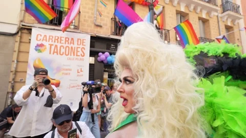 Drag queen entertaining the audience during heels race, Gay Pride 2023, 4k Stock Footage 244883113