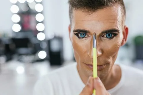 Drag queen making up alone behind the scenes Stock Photos