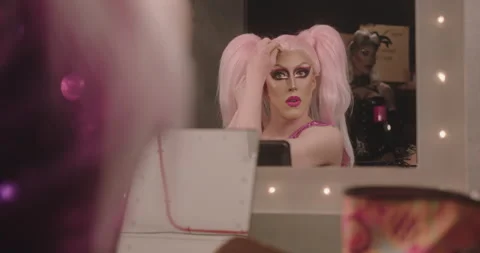 Drag Queen putting on Wig Backstage, looking in Mirror Stock-Footage 194261042