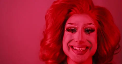 Drag queen smiling on camera with red light inside studio - Lgbtq concept Stock Footage 155437963