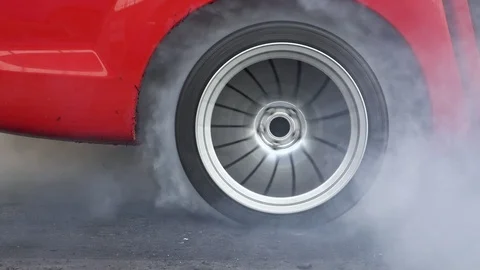 Drag racing car burn tire at start line Stock Footage