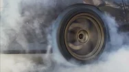 Drag Racing Car Burns Rubber Off Its Tires In Preparation For The Race Stock Footage