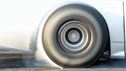Drag racing car burns rubber off its tires in preparation for the race 스톡 동영상 85713331