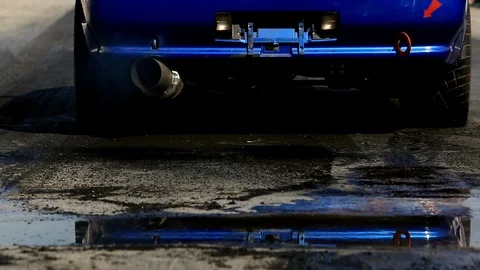 Drag racing car burns rubber off its tires in preparation for the race 스톡 동영상 85713662
