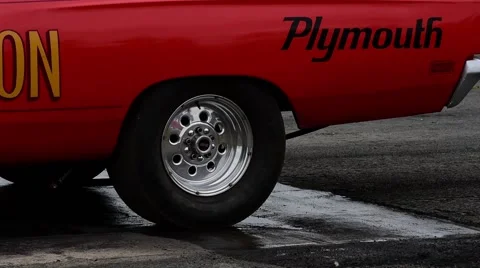 Drag racing driver warming up tyres at start of race, york raceway uk Stock Footage 63662709