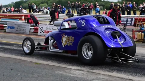 Drag racing driver warming up tyres at start of race, york raceway uk Stock Footage 64205860