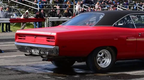 Drag racing driver warming up tyres at start of race, york raceway uk Stock Footage 67895350