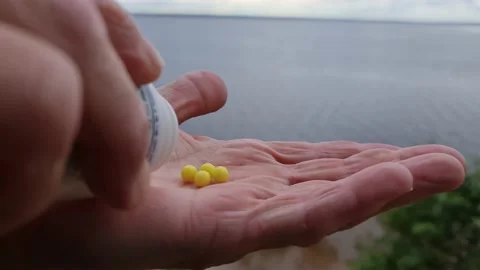Dragee of ascorbic acid. Yellow multivitamins. Vitamin C. Stock-Footage 156663639