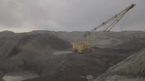 A dragline excavator working on development of open fields Stock Footage 64258077