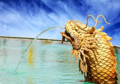 The dragon being spray water. Stock Photos