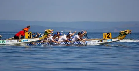 Dragon boat racing on sea. Active sports and competition. Russia, Vladivostok. Stock Photos