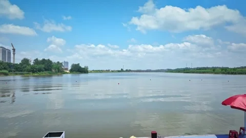 Dragon Boat team rowing to the pace of an onboard Drummer yueyang miluo Stock Footage 325173811