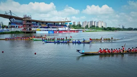 Dragon Boat team rowing to the pace of an onboard Drummer yueyang miluo Stock Footage 325175088