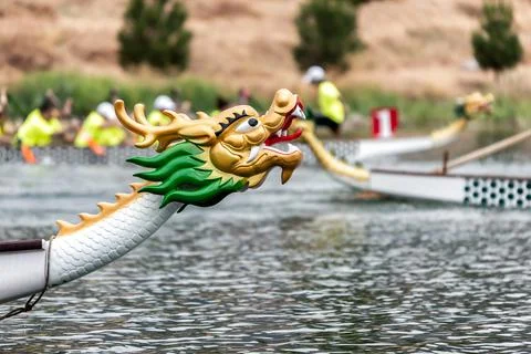 Dragon boats racing. Decorated head of the boat. Stock Photos