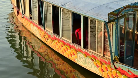 A Dragon Boat’s Reflection: Capturing the Serenity of Hue’s River Stock Footage 296192937