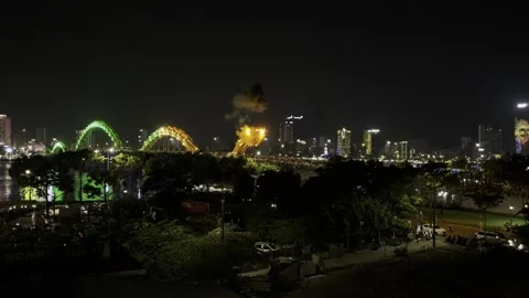 Dragon Bridge in Da Nang fire-breathing show from the side Stock Footage 314461183