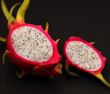 Dragon fruit on a black background Stock Photos