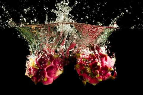 Dragon Fruit Falling into the water Stock-Fotos