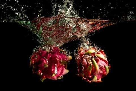 Dragon Fruit Falling into the water Stock-Fotos