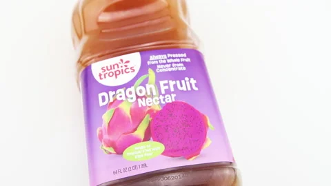 Dragon fruit juice, nectar plastic bottle by Sun Tropics macro closeup Stock Footage 231584242