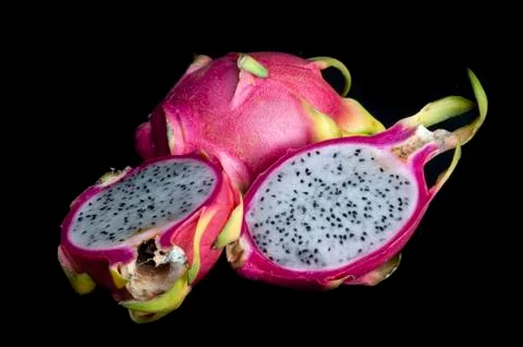 Dragon fruit on a plain black background Stock Photos