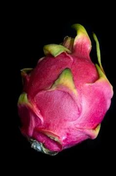 Dragon fruit on a plain black background Stock Photos