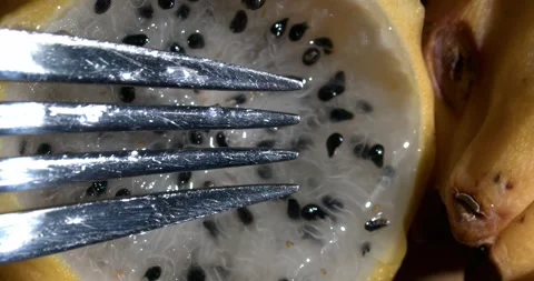 Dragon fruit pulp being stirred with a fork Stock Footage 301017414