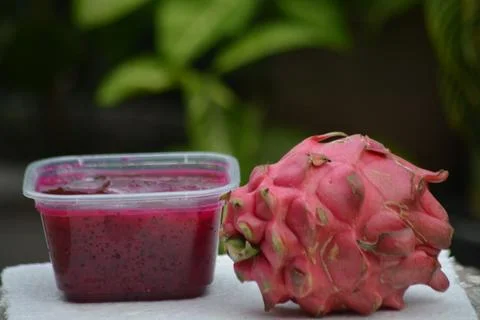 Dragon Fruit Pulp in Clear Container with Whole Fruit Stock Photos