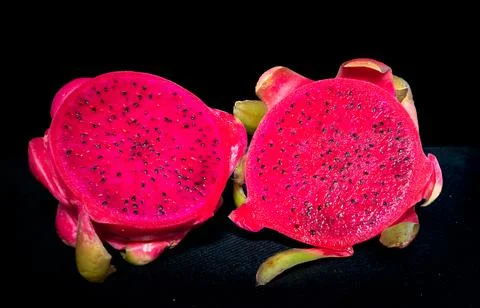 Dragon fruit set isolated on a black background as a package design element. Stock Photos