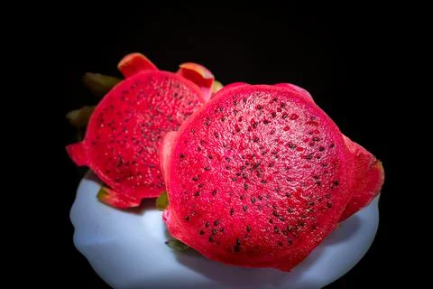 Dragon fruit set isolated on a black background as a package design element. Stock Photos
