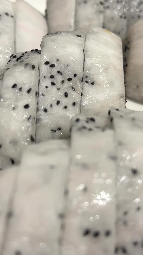 Dragon fruit slice. Dragon fruit slice texture kept on rotating disk. Stock Footage 310431903