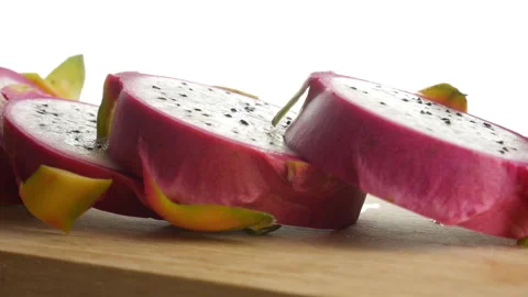 Dragon fruit slices on cutting board, white Pitaya slow rotation Stock Footage 150356742