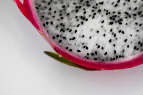 Dragon fruit. Vibrant Dragon Fruit on white background. Sliced white dragon Stock Photos