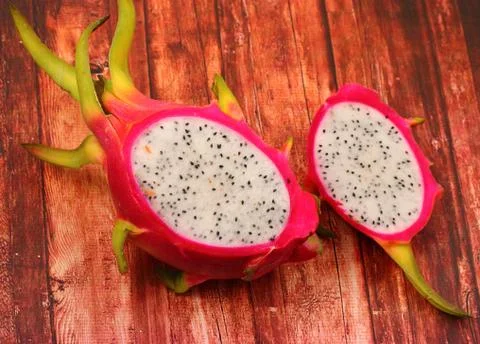 Dragon fruit on a wood table top Stock Photos