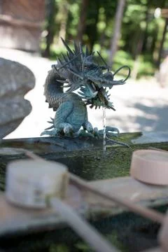Dragon shaped water spring in a temple Stock Photos