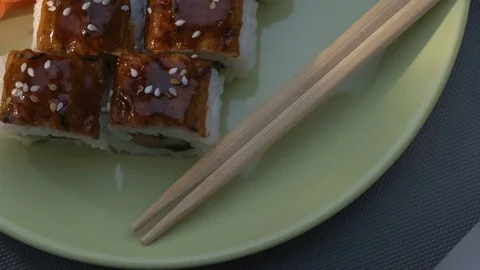 "Dragon" square sushi rolls with eel, salmon, cucumber, nori, sushi rice, sesame Stock Footage 75034030